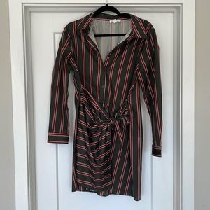 Worn once - green stripped dress with bow and shaping on front side of dress